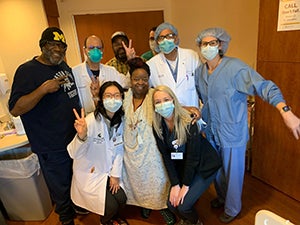 A Trinity Health Michigan stroke patient celebrates recovery with her clinical team