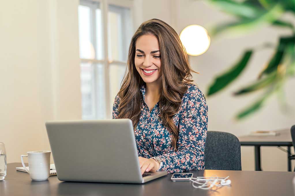 Woman scheduling on laptop