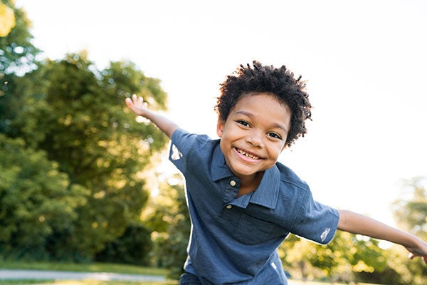 Young boy playing outside
