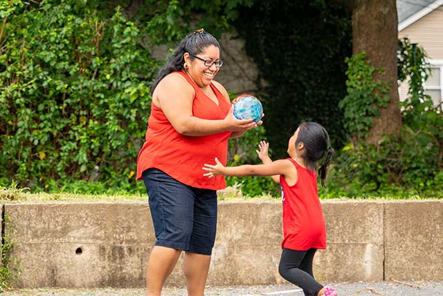 Mother and son playing outdoors