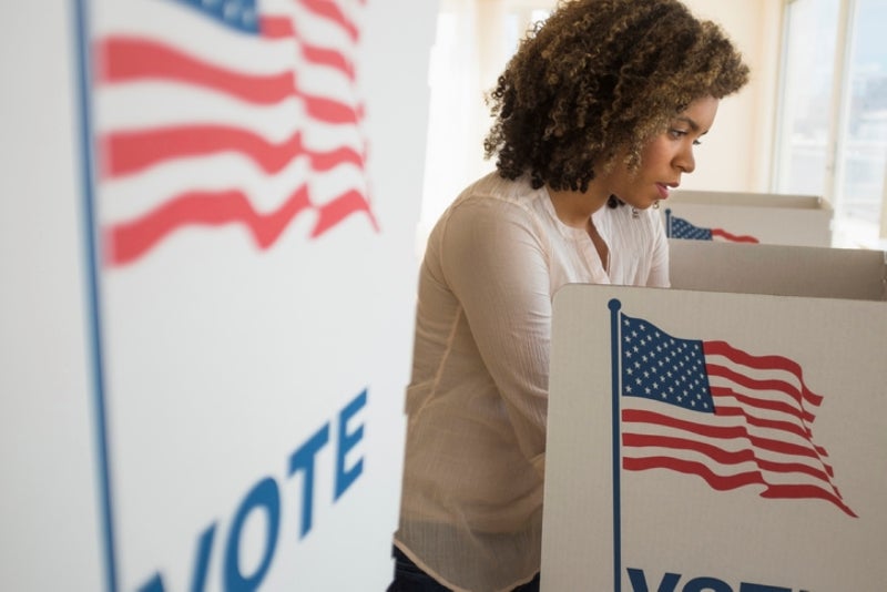 Woman at voting booth