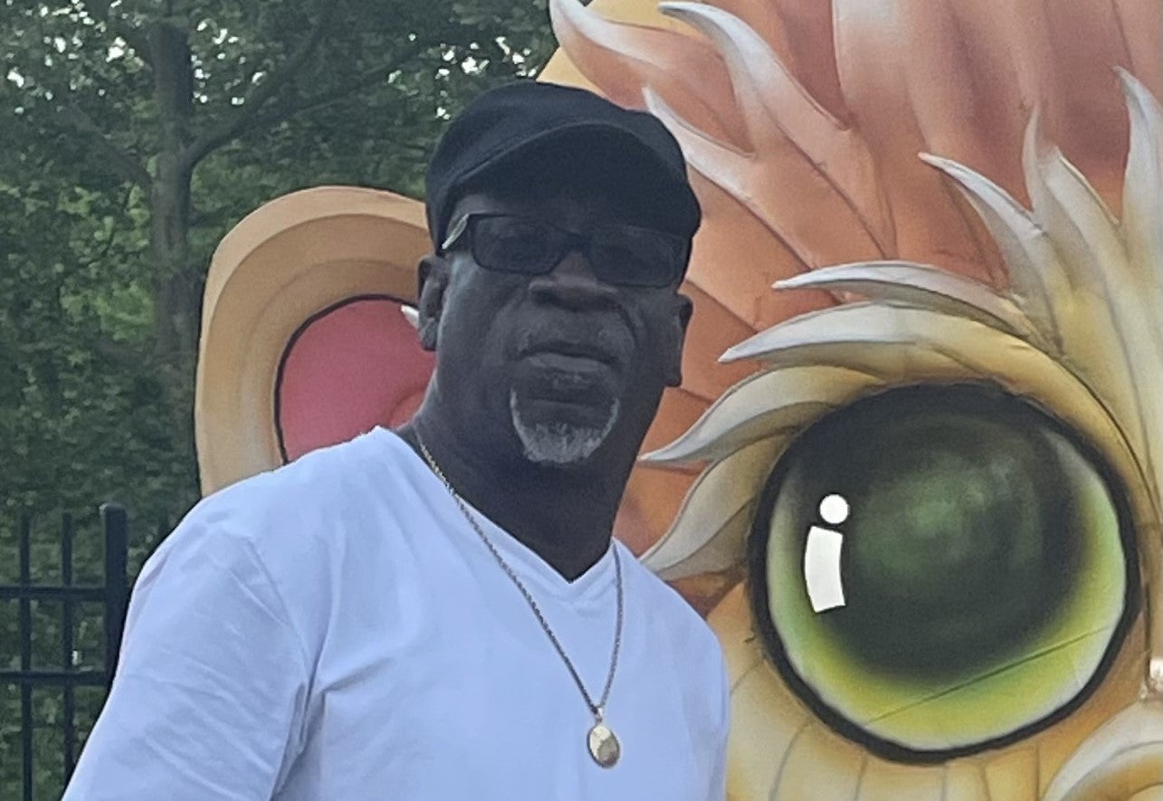 Undra Brown standing near art exhibit