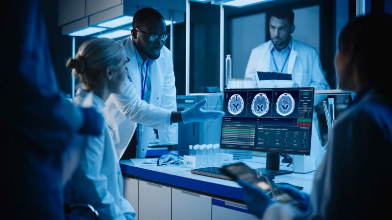 stroke team looking at brain scan