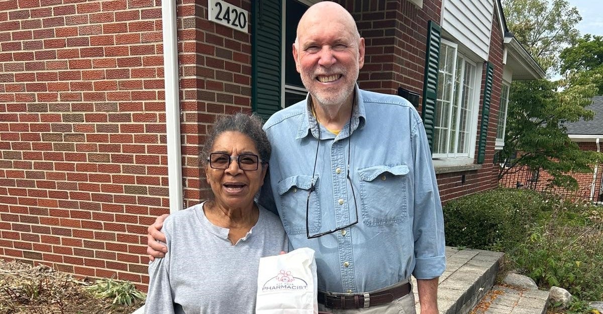 Bob outside his home with his wife, after he left the hospital