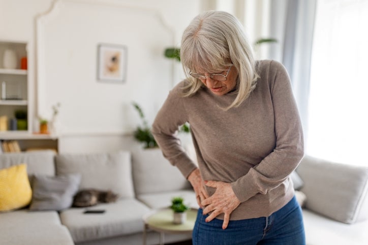 lady grabbing her hip in pain
