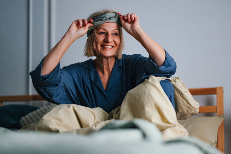 An Older Woman Wakes up with a Sleep Mask on