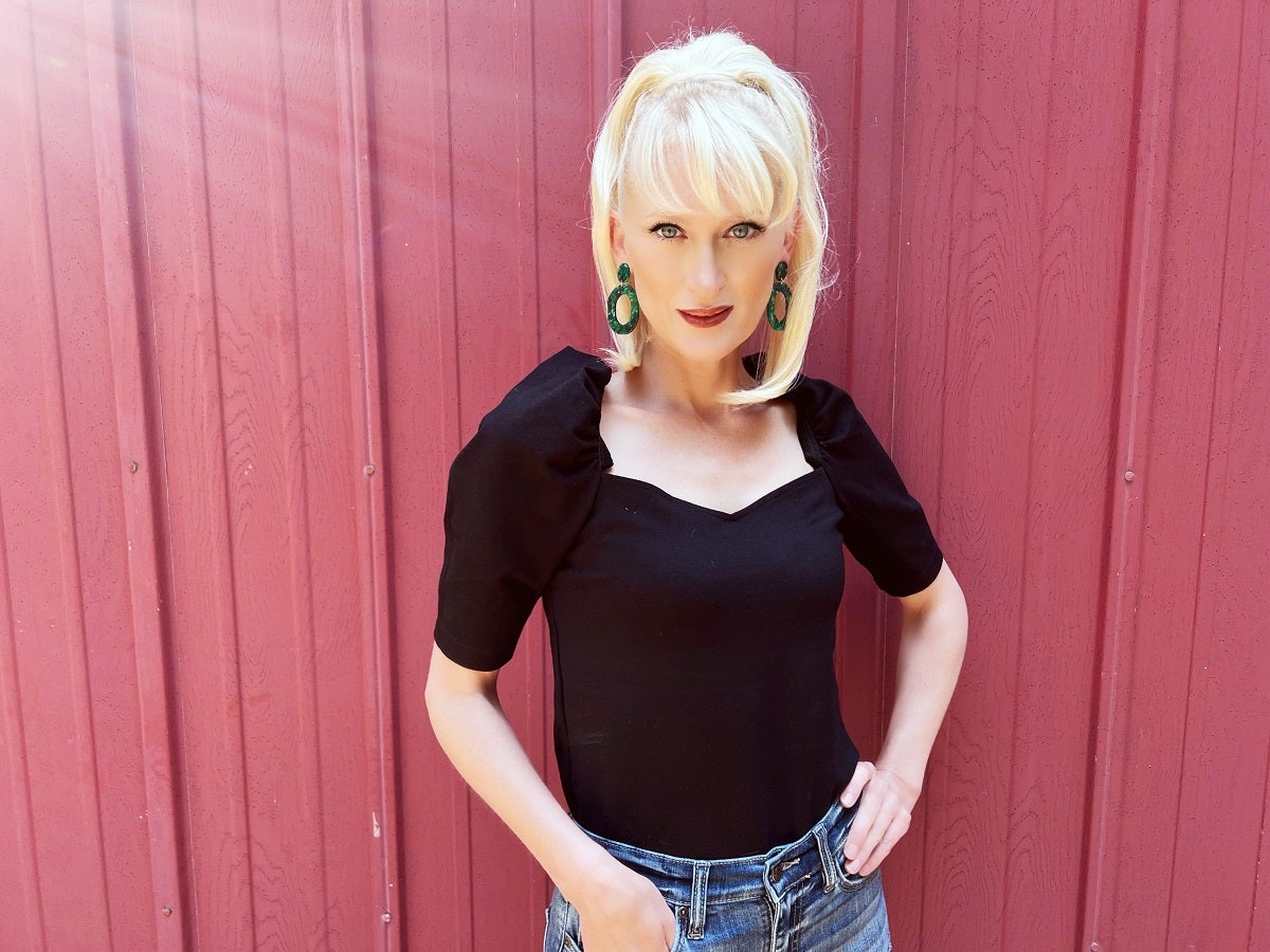 Patient in outdoor setting smiling at camera