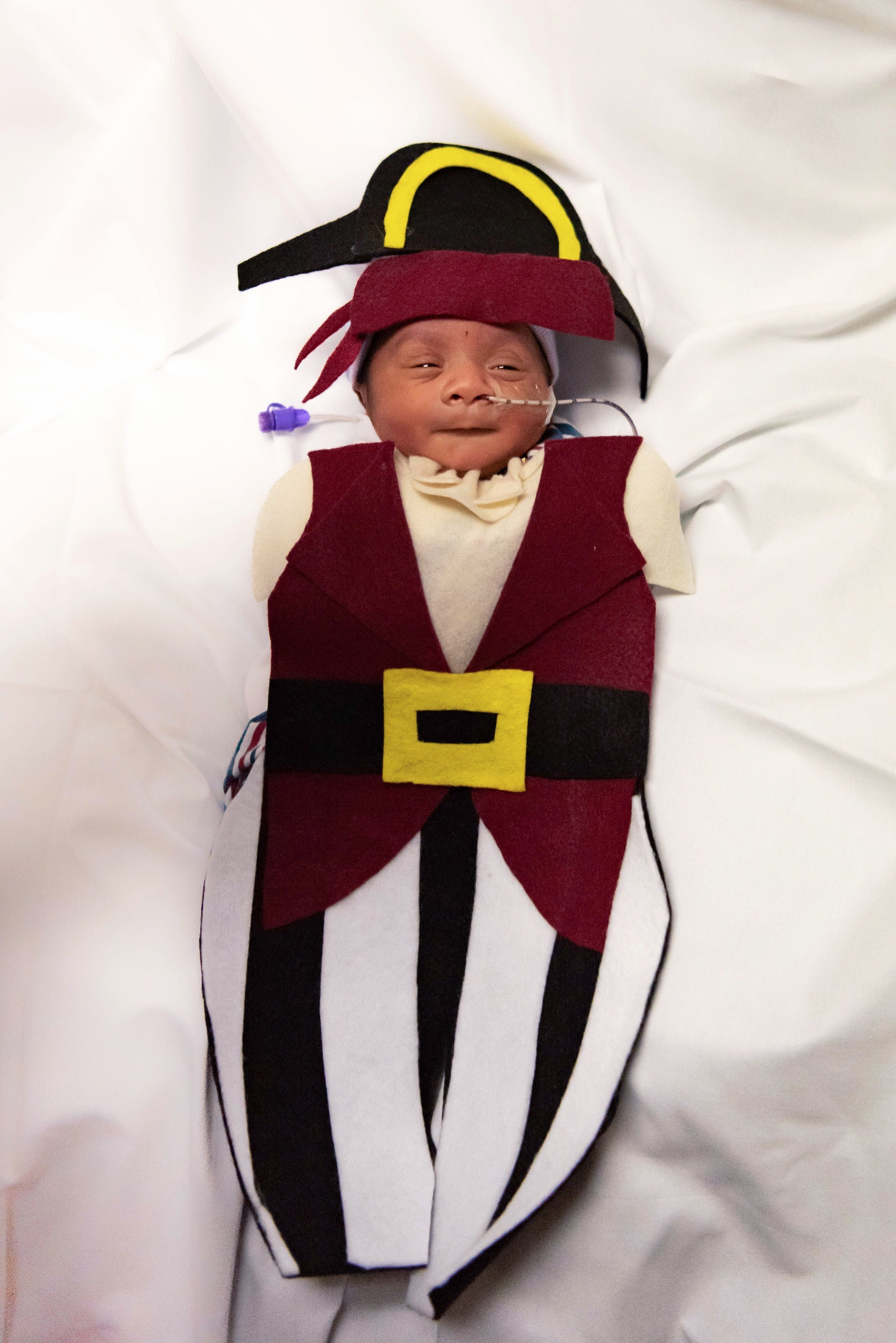 NICU patient dressed in pirate Halloween costume
